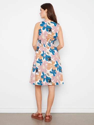 Stylish floral pattern dress with a flattering V-neckline and practical hidden pockets by Charlie B.