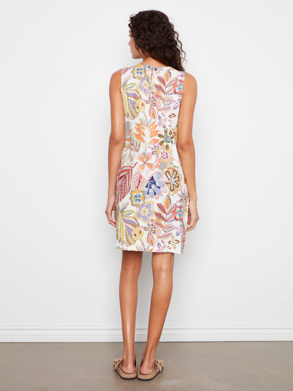 Decorative side buttons add charm to this lively printed dress, making it an eye-catching choice for any wardrobe update. By Charlie B.