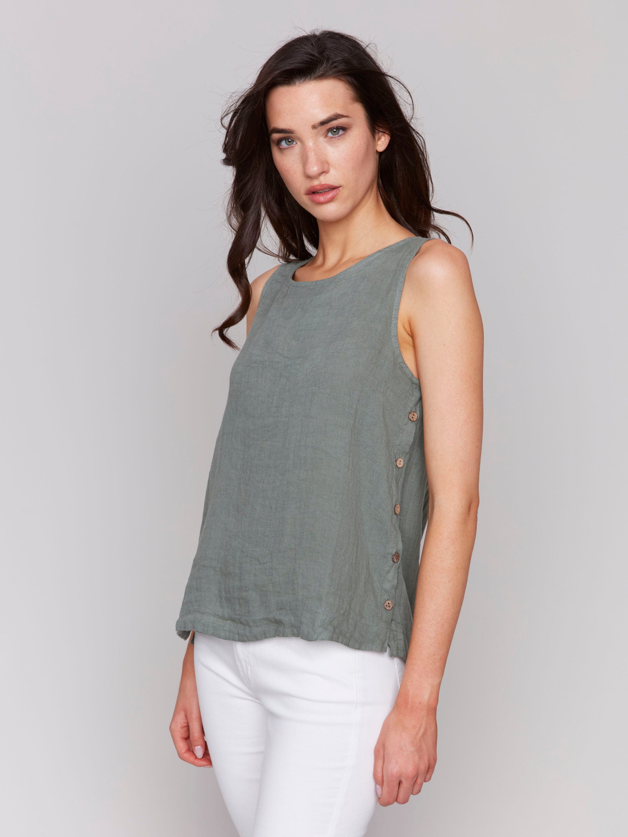 Sleeveless celadon tank top featuring unique side button detailing by Charlie B.