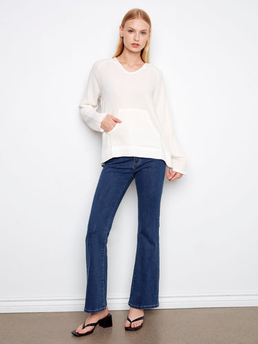 Chic and versatile white hoodie made from breathable 100% cotton, complete with practical kangaroo pocket by Charlie B.