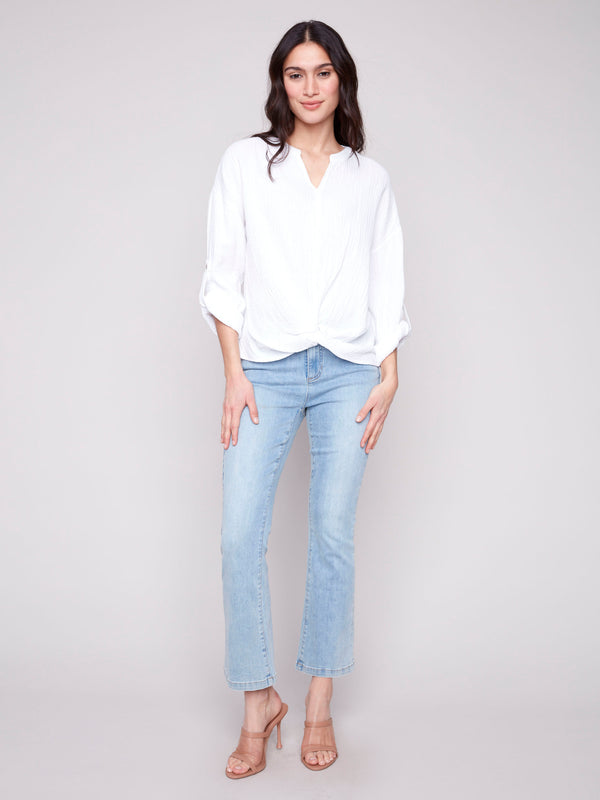 Elegant white blouse featuring twist detail at the front for a chic look by Charlie B.