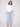Versatile white blouse with adjustable sleeves, offering both comfort and style by Charlie B.