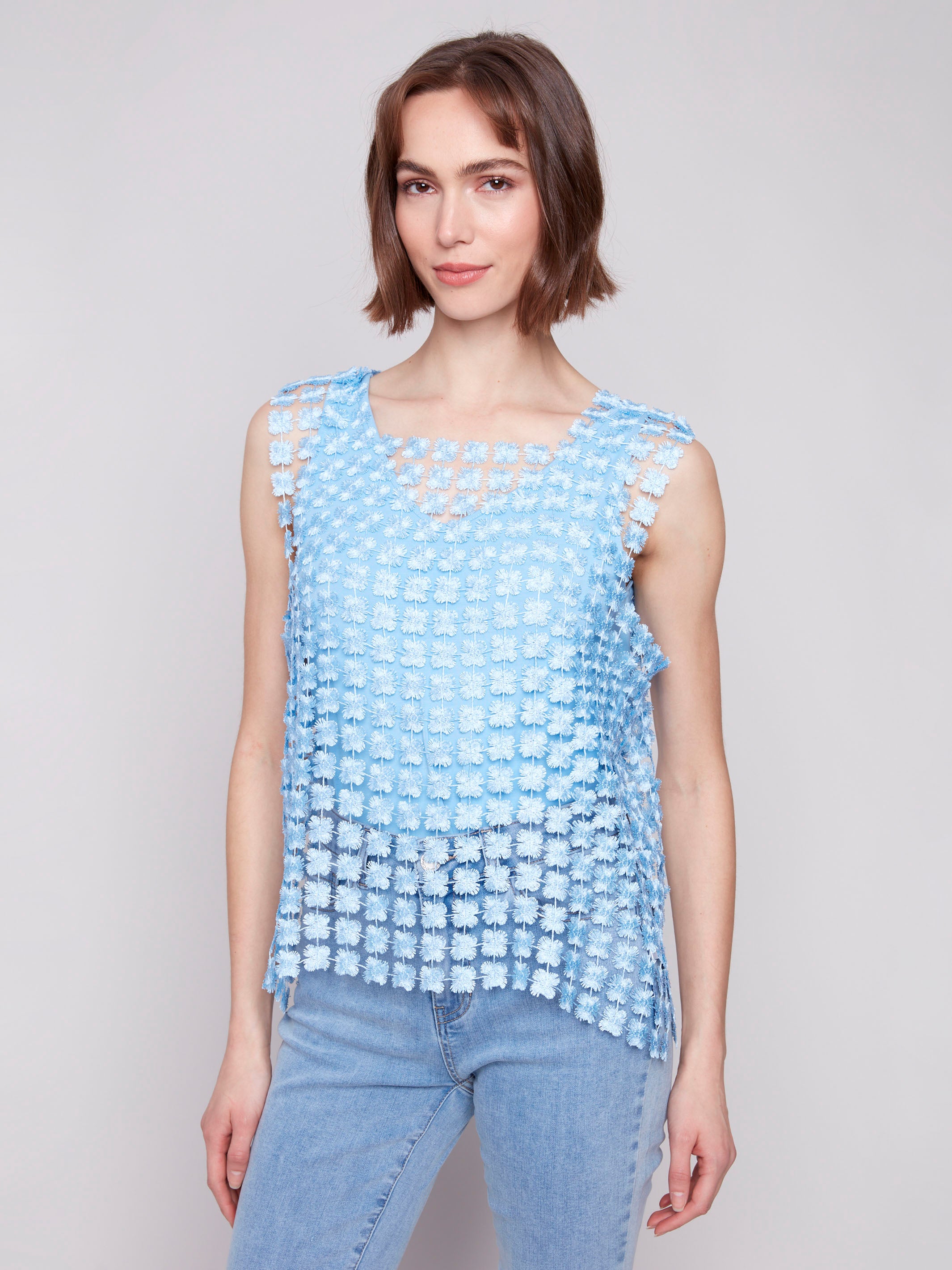 Bluebell top with a crochet flower pattern and runs large by Charlie B.