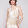 Gold crochet top featuring a sleeveless design by Charlie B.