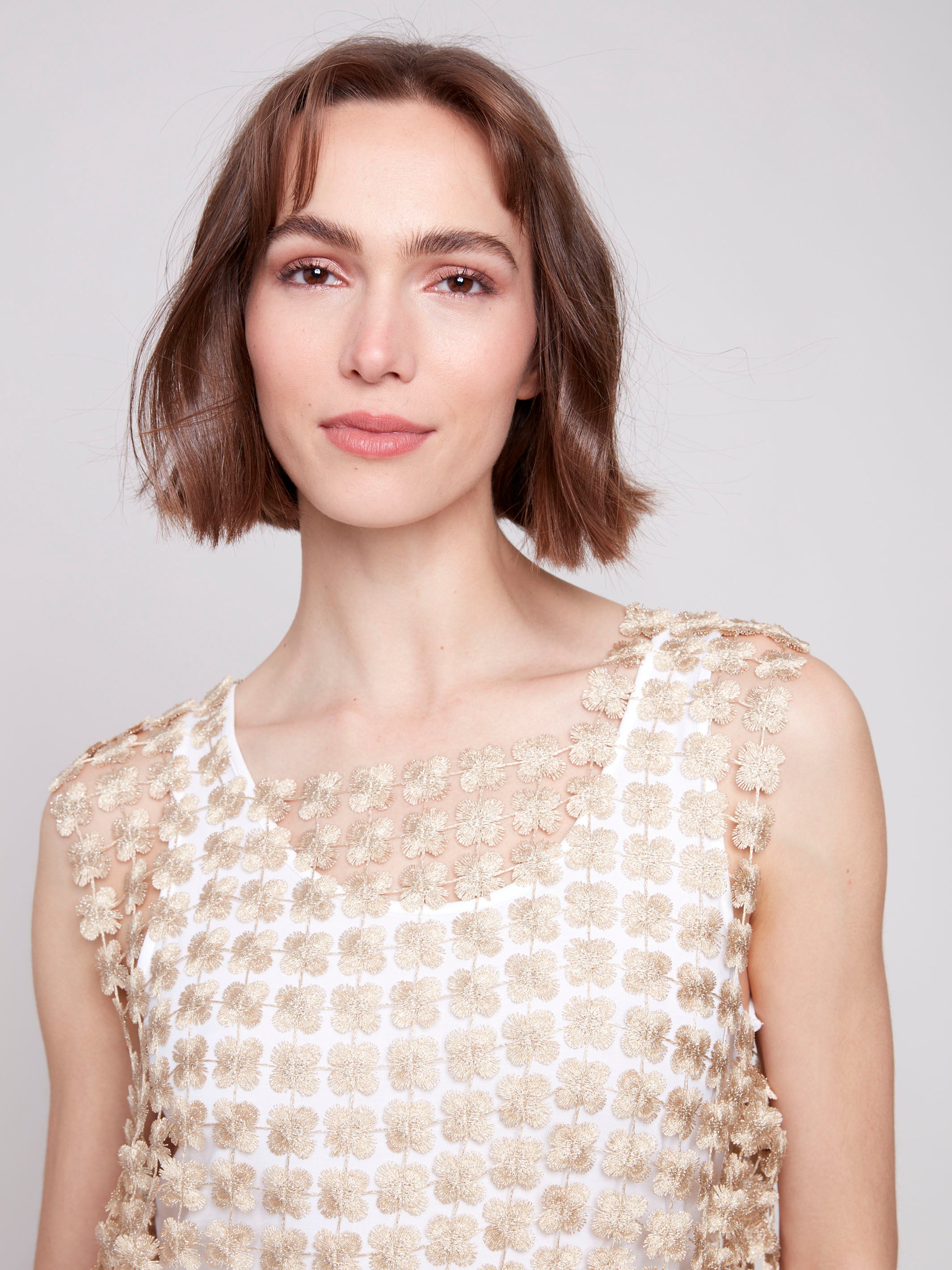 Elegant sleeveless crochet top that runs large by Charlie B.