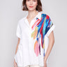 Shirt with a stylish collar and vibrant feather design by Charlie B.