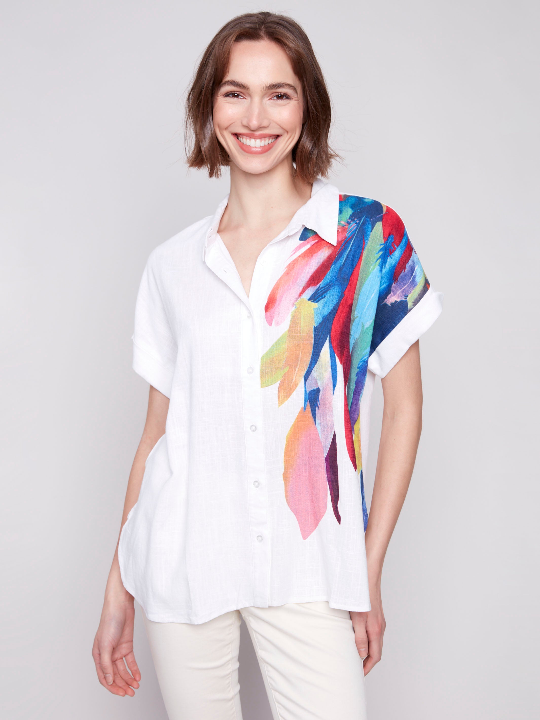 Feather print highlights one shoulder of this chic shirt by Charlie B.