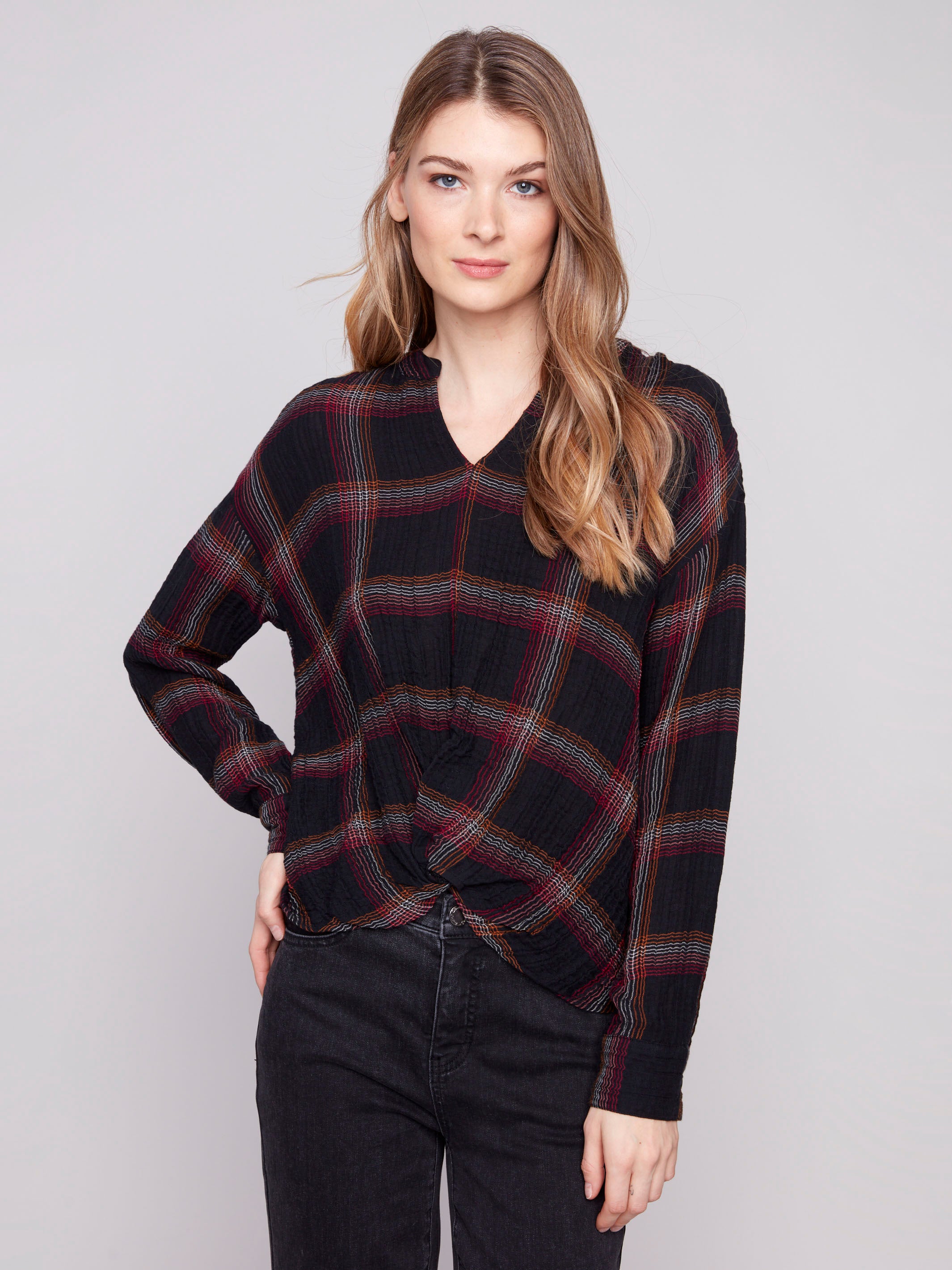 Fuchsia plaid blouse featuring a V-neck with Mao collar, adding a unique touch to the design by Charlie B.