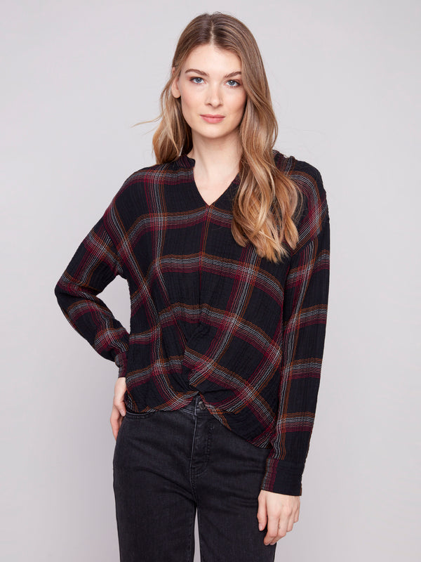 Fuchsia plaid blouse featuring a V-neck with Mao collar, adding a unique touch to the design by Charlie B.