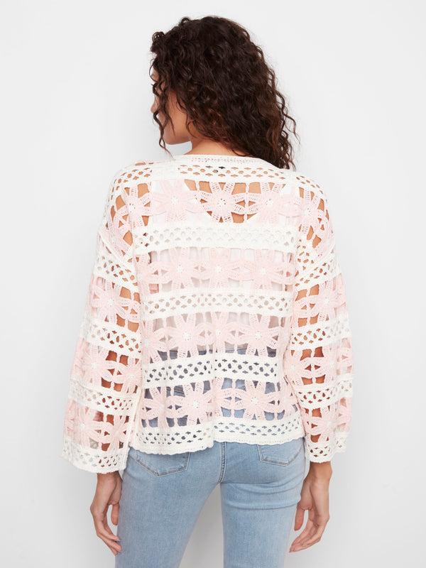 Beautifully crafted cotton blend top with intricate crochet design that stands out for its unique texture and style. By Charlie B.
