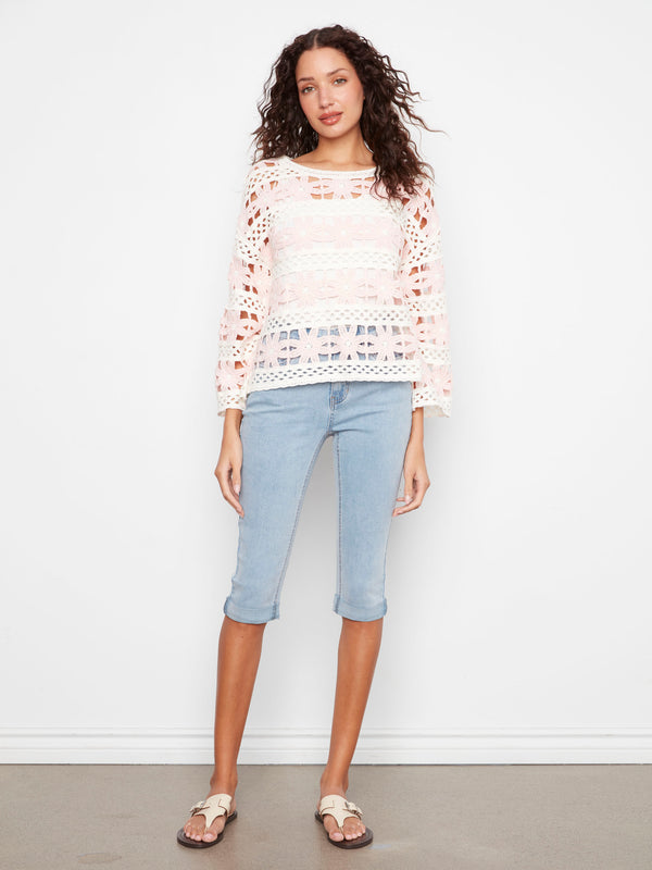 Chic crochet top with 3/4 bell sleeves, perfect for adding flair to any outfit while ensuring comfort all day long. By Charlie B.