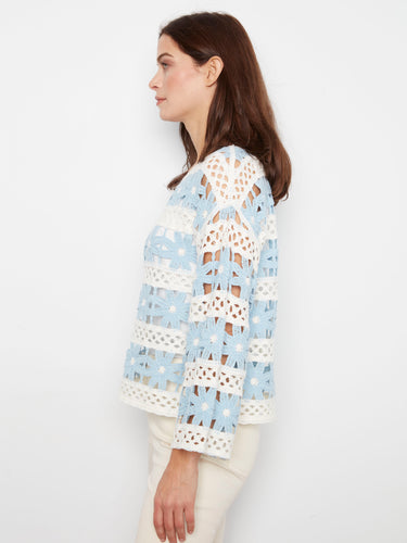 The boat neckline enhances the chic look of this crochet top, while the light blue flowers add a fresh touch to your wardrobe by Charlie B.