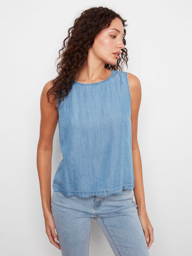 Medium blue sleeveless design with elegant scallop hem detail, perfect for any occasion by Charlie B.