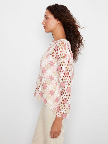 Beautifully crafted crochet top in white and pink floral pattern, featuring 3/4 sleeves for elegance. By Charlie B.