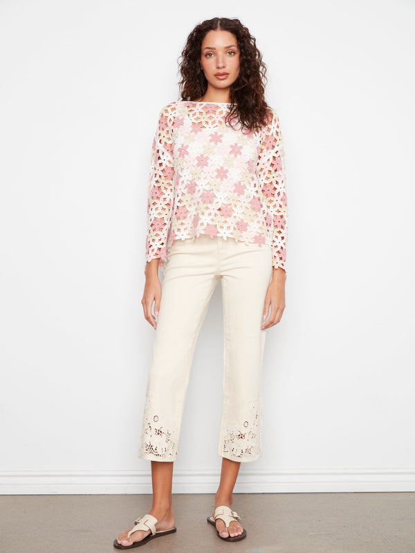 Floral-patterned crochet top in soft hues of white and pink, complete with 3/4 sleeves for versatile styling. By Charlie B.