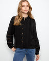 Black crepe blouse with button-front closure and gold accents for a chic look by Charlie B.