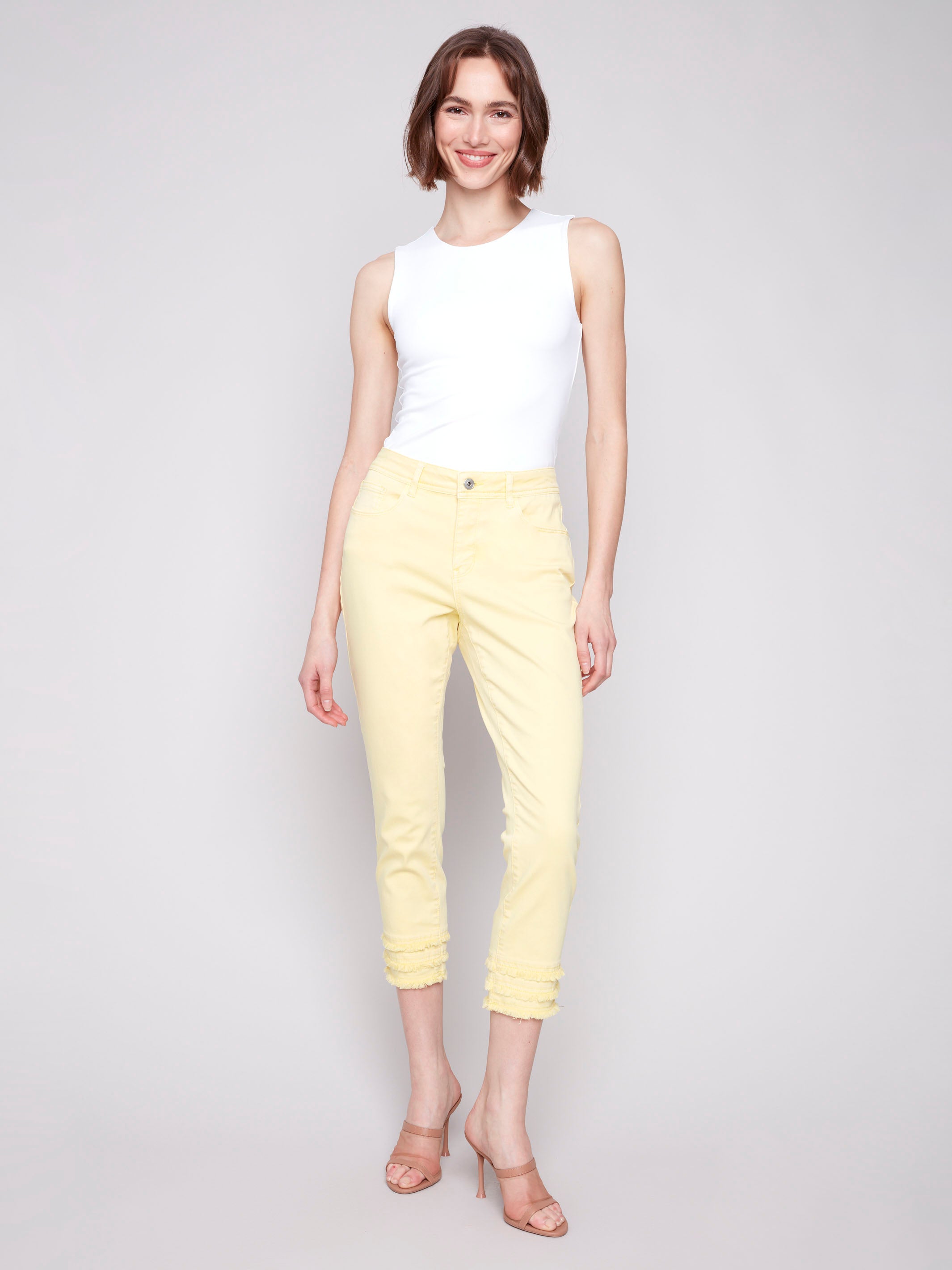 Yellow twill pants with a regular rise waist and cropped length by Charlie B.