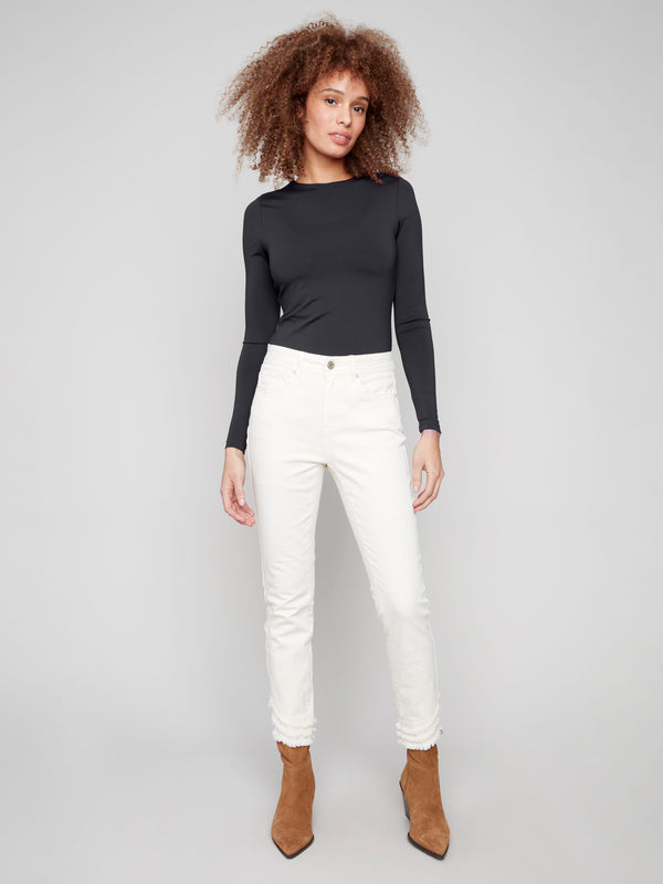 Natural-colored skinny twill pants with frayed hem, featuring a regular rise and five-pocket design by Charlie B.