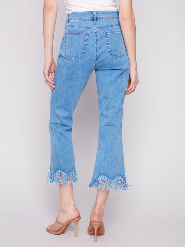 Blue cropped jeans with a fashionable fringed hem and bootcut leg design by Charlie B.