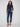 Dark blue jeans with a slim fit, showcasing a regular rise and stretch denim for comfort by Charlie B.