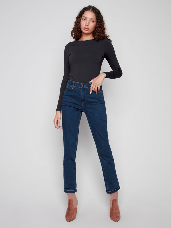 These jeans feature a long length and stretch denim fabric, perfect for versatile styling by Charlie B.