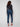 Dark blue slim leg jeans with a cuffed hem, featuring a classic five-pocket design and button closure by Charlie B.