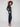 These pull-on style navy pants come with convenient side zip pockets for added functionality by Charlie B.