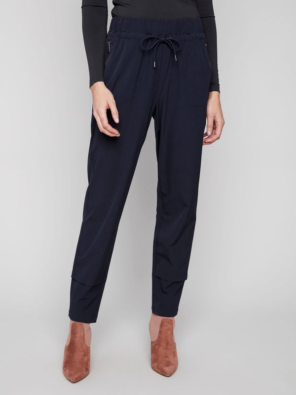 Navy slim-leg pants designed with cuff detail, offering a chic and modern look by Charlie B.