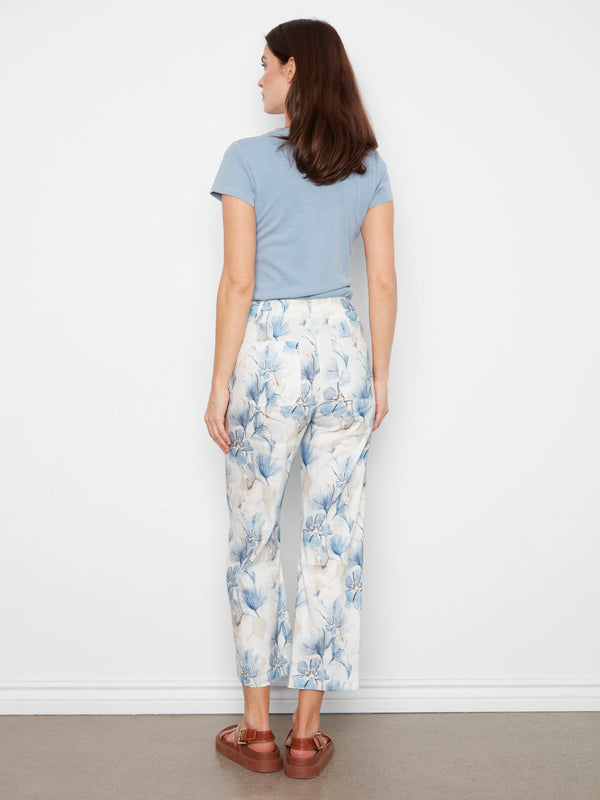 Wide legged trousers adorned with florals, offering both comfort and fashion-forward appeal. Expertly crafted by Charlie B.