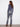Showcasing the subtle shine of these stylish Roseblue bootcut jeans by Charlie B.