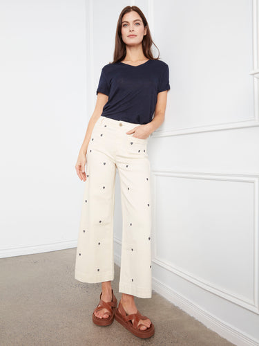 Embroidered hearts add a playful touch to these versatile stretch twill fabric trousers by Charlie B.