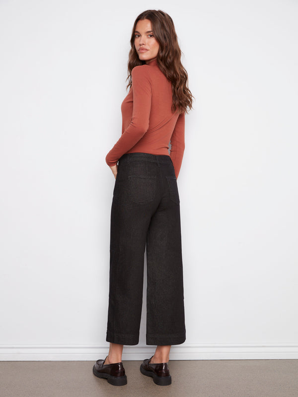 Crafted from stretch denim, these black cropped flare jeans offer both style and comfort by Charlie B.
