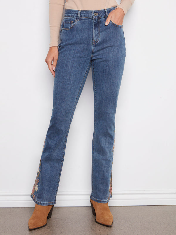 These medium blue jeans feature a regular rise and elegant floral embroidery on the sides, adding a chic touch by Charlie B.