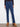 These indigo jeans feature a five-pocket design and elegant floral embroidery for added charm by Charlie B.