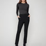 Black slim-fit dress pants with stretch fabric, featuring two back welt pockets for added style and comfort by Charlie B.