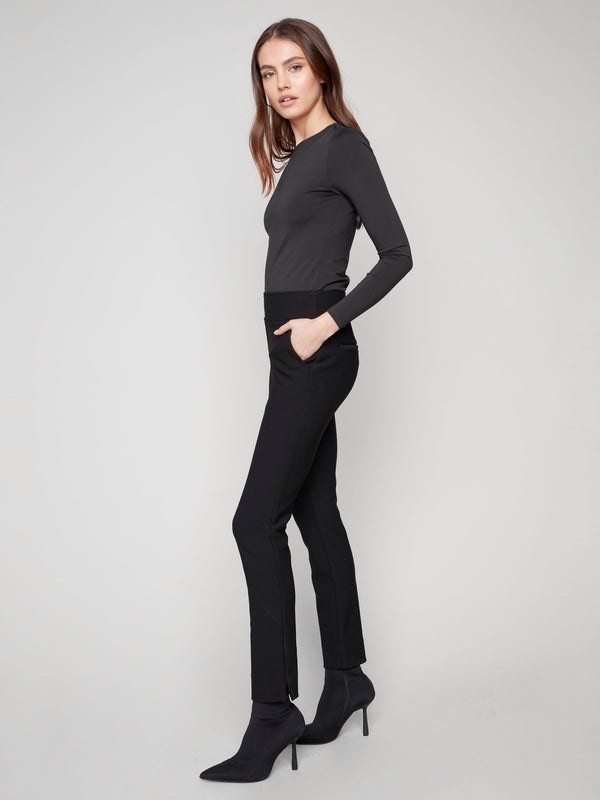 Chic black slim-fit pants featuring two side pockets, perfect for a stylish yet functional wardrobe addition by Charlie B.
