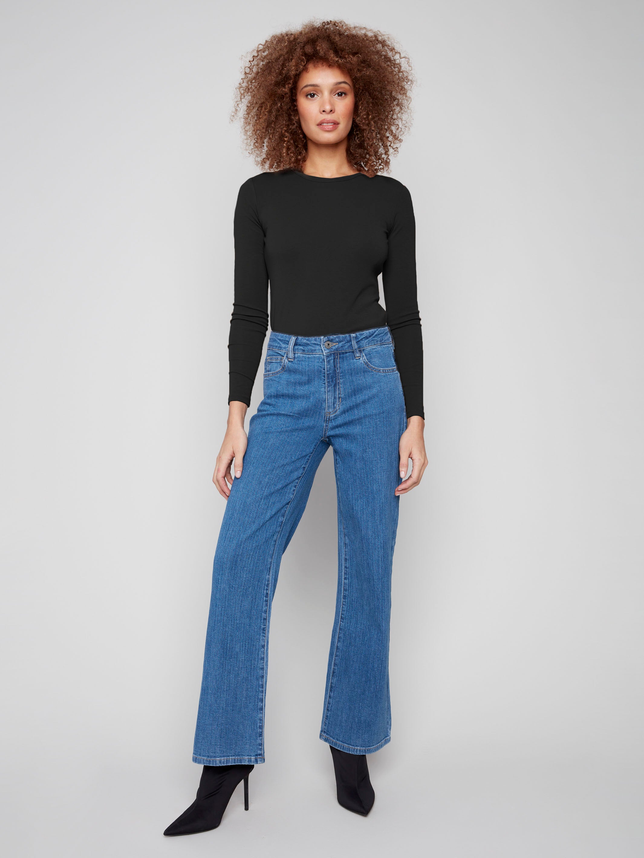Blue wide-leg jeans in stretch corduroy denim, offering a comfortable fit by Charlie B.