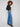 These long-length blue jeans feature a stylish five-pocket design by Charlie B.