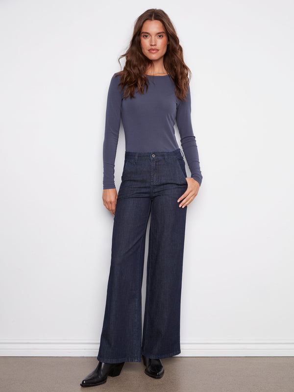 Blue-black jeans featuring a long length and button front closure, perfect for versatile styling by Charlie B.