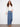 Blue jeans featuring a long length design and button front, perfect for any occasion by Charlie B.