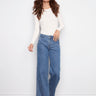 Blue jeans featuring a long length design and button front, perfect for any occasion by Charlie B.