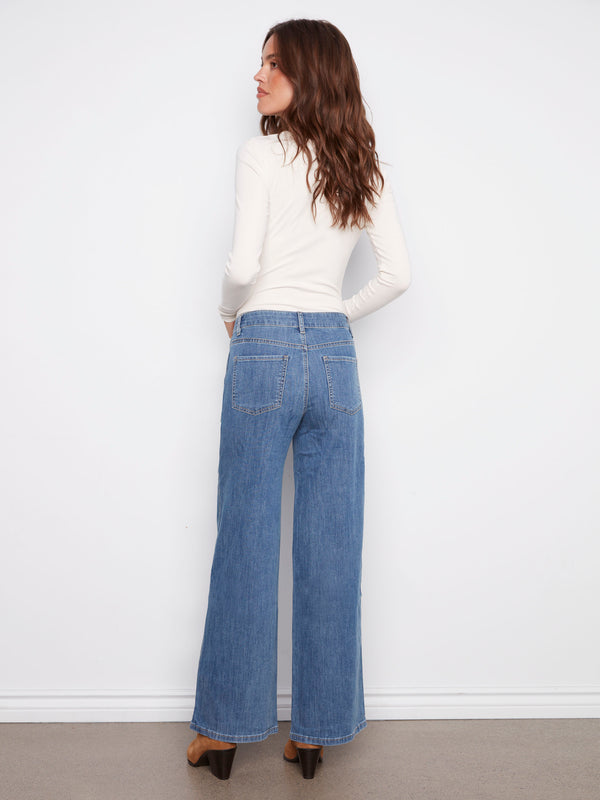 Classic blue jeans with a focus on their wide leg cut, ideal for versatile styling by Charlie B.