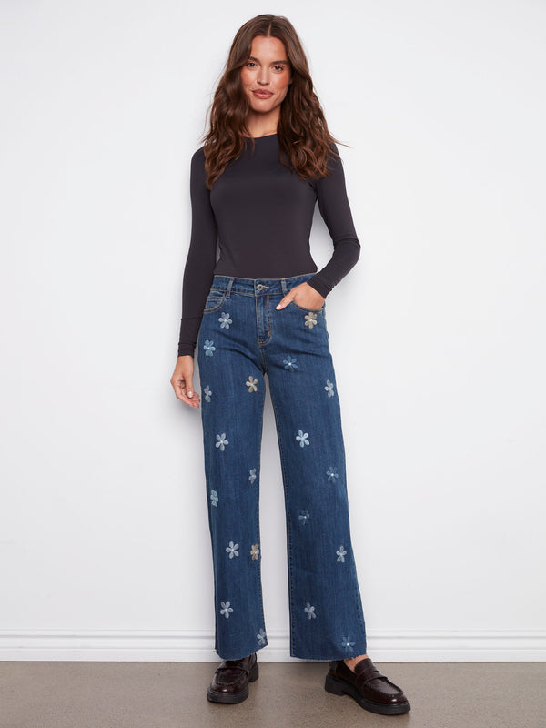 Indigo jeans featuring a regular rise and stylish flower patches, perfect for a chic casual look by Charlie B.