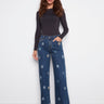 Indigo jeans featuring a regular rise and stylish flower patches, perfect for a chic casual look by Charlie B.