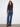 Indigo denim pants adorned with five-pocket design and cute flower details, ideal for versatile styling by Charlie B.