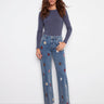 Medium blue jeans featuring a stylish raw hem and floral patches, perfect for casual outings by Charlie B.