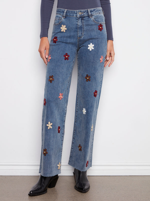 These medium blue jeans offer a regular rise with charming flower patches, blending comfort and style by Charlie B.