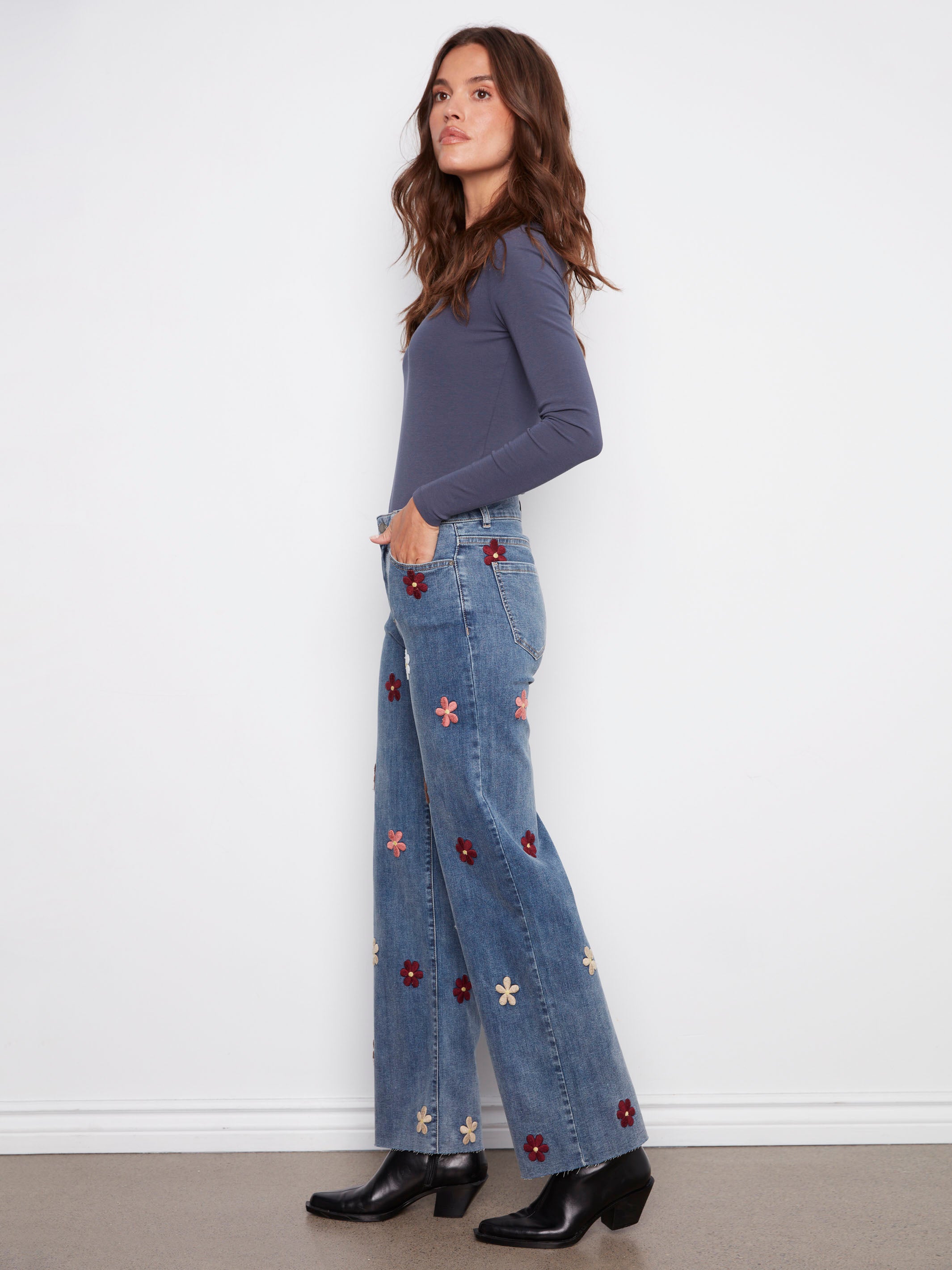Stretch denim in medium blue with delightful flower patches adds flexibility to your wardrobe by Charlie B.