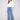 Medium blue jeans featuring a five-pocket design and floral embroidery for a chic look by Charlie B.