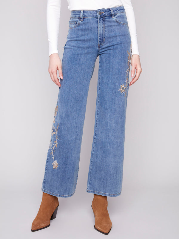 Stylish wide leg jeans with regular rise and intricate floral embroidery by Charlie B.
